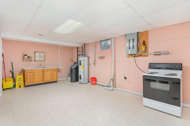 26976 Jackson Rd, Circleville, OH 43113 - kitchen with electric stove, water heater, concrete block wall, a sink, and light countertops