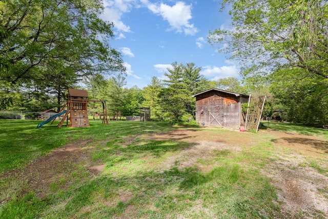 26976 Jackson Rd, Circleville, OH 43113 - view of green lawn featuring a playground and an outdoor structure
