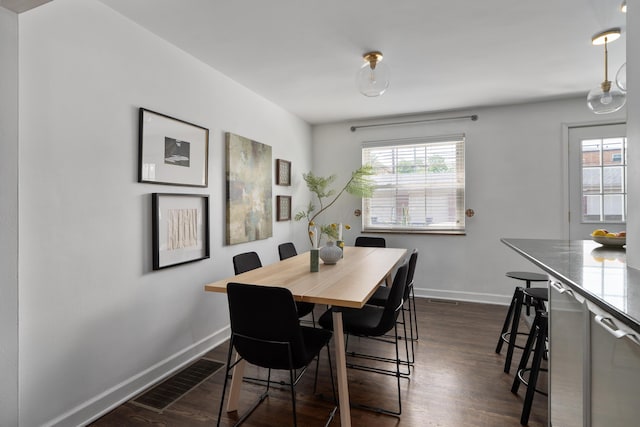 1809 NW Ct Unit E, Columbus, OH 43212 - dining space featuring baseboards and dark wood-style flooring