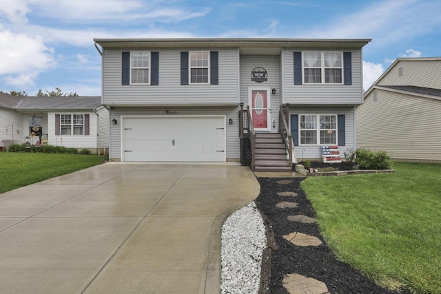 4292 Nipigon Dr, Columbus, OH 43207 - view of front of home featuring a garage, concrete driveway, and a front lawn