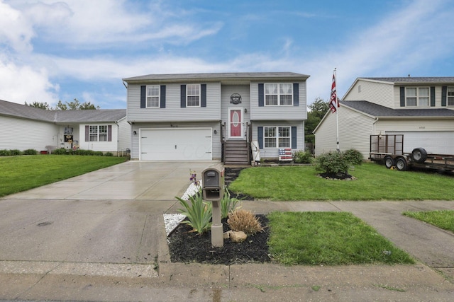 4292 Nipigon Dr, Columbus, OH 43207 - bi-level home featuring concrete driveway, a garage, and a front yard