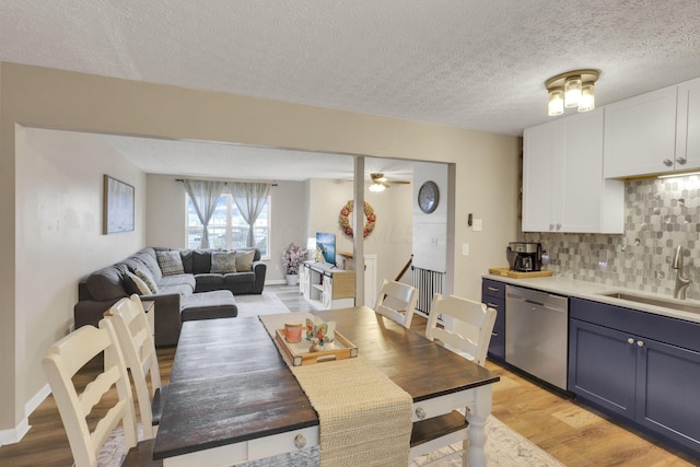 4292 Nipigon Dr, Columbus, OH 43207 - dining room featuring light wood-style flooring, a textured ceiling, and a ceiling fan