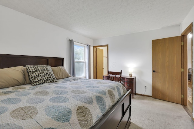 4292 Nipigon Dr, Columbus, OH 43207 - bedroom featuring light colored carpet, baseboards, and a textured ceiling