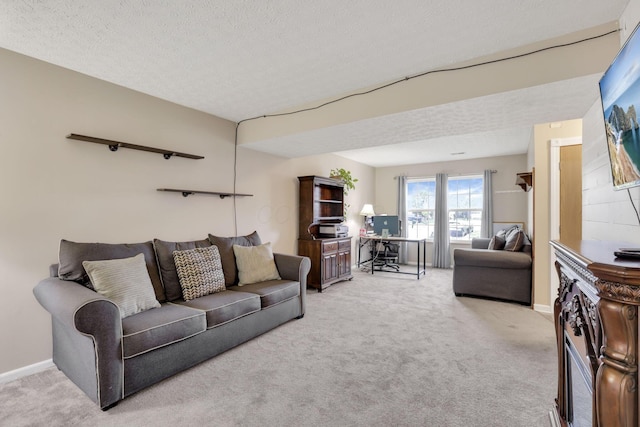 4292 Nipigon Dr, Columbus, OH 43207 - carpeted living area with a textured ceiling and baseboards
