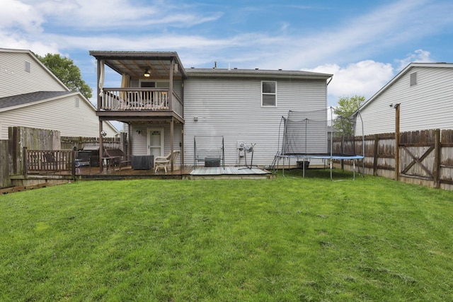 4292 Nipigon Dr, Columbus, OH 43207 - rear view of house with a deck, a balcony, and a trampoline