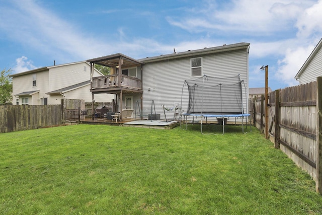 4292 Nipigon Dr, Columbus, OH 43207 - rear view of property with a balcony, a trampoline, and a deck