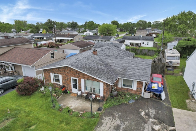 4969 Lockbourne Rd, Columbus, OH 43207 - view of front of house featuring a residential view, brick siding, a patio, and a front yard