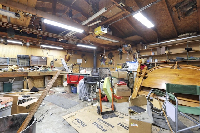 4969 Lockbourne Rd, Columbus, OH 43207 - garage with a workshop area and a garage door opener