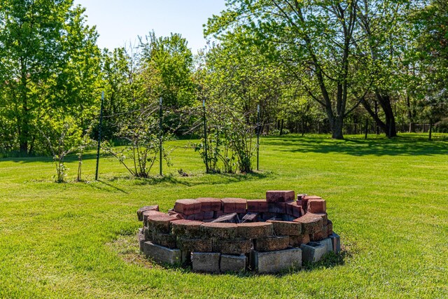 1150 Bahama Dr, Marion, OH 43302 - view of green lawn with a fire pit