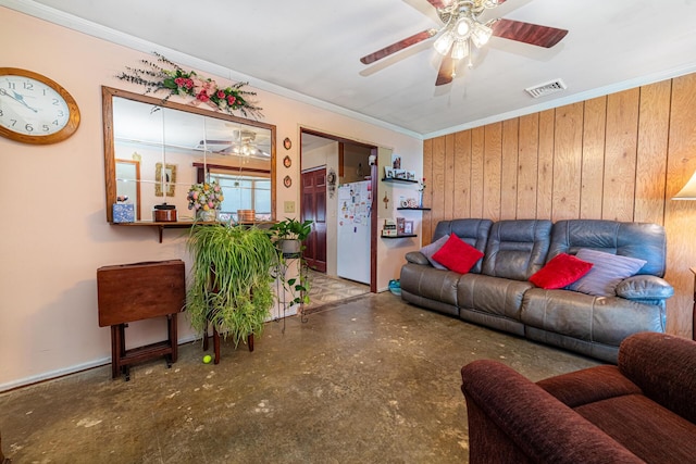 1150 Bahama Dr, Marion, OH 43302 - living area featuring a ceiling fan, ornamental molding, wood walls, and baseboards