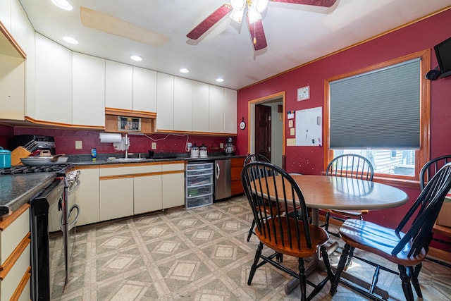 1150 Bahama Dr, Marion, OH 43302 - kitchen with a sink, ceiling fan, dark countertops, recessed lighting, and white cabinetry
