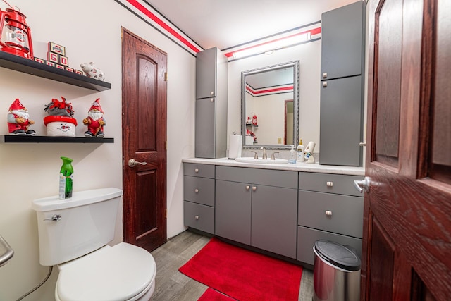 1150 Bahama Dr, Marion, OH 43302 - bathroom with wood finished floors, toilet, and vanity