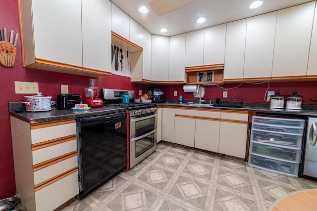 1150 Bahama Dr, Marion, OH 43302 - kitchen with range with two ovens, dishwasher, white cabinetry, dark countertops, and recessed lighting