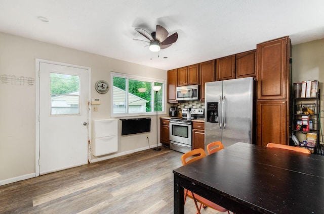3408 Dahlgreen Dr, Westerville, OH 43081 - kitchen featuring stainless steel appliances, ceiling fan, wood finished floors, baseboards, and tasteful backsplash