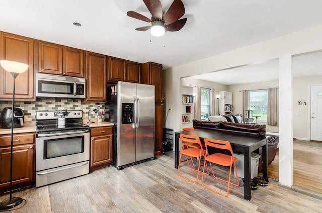 3408 Dahlgreen Dr, Westerville, OH 43081 - kitchen with appliances with stainless steel finishes, light wood finished floors, and light countertops