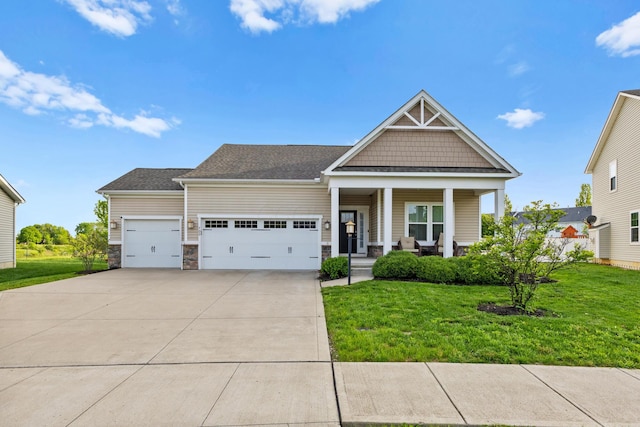 700 Ferguson Ave, Delaware, OH 43015 - craftsman-style home with covered porch, an attached garage, driveway, and a front yard