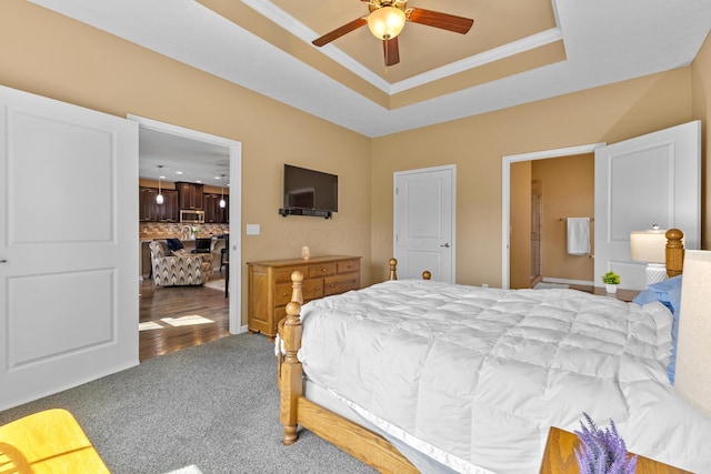 700 Ferguson Ave, Delaware, OH 43015 - bedroom with a tray ceiling, carpet flooring, ceiling fan, and crown molding