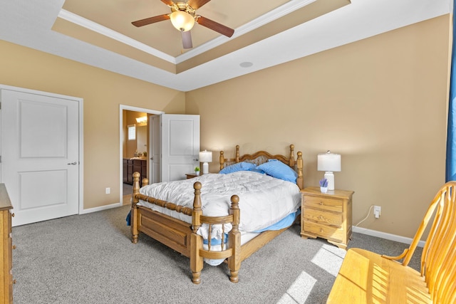 700 Ferguson Ave, Delaware, OH 43015 - carpeted bedroom featuring a raised ceiling, crown molding, baseboards, and connected bathroom