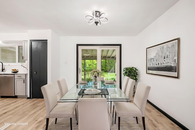dining area featuring light wood-style floors
