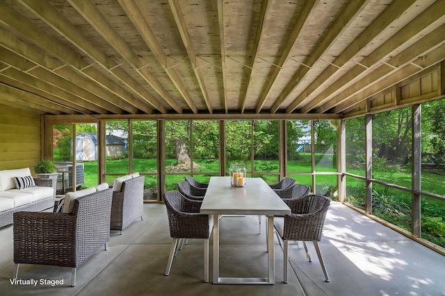 sunroom / solarium featuring outdoor dining area and outdoor lounge area