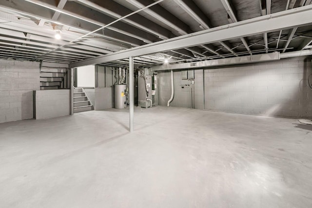 unfinished below grade area featuring water heater, stairway, and heating unit