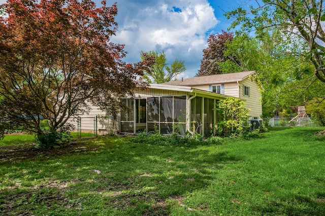 rear view of house with a sunroom