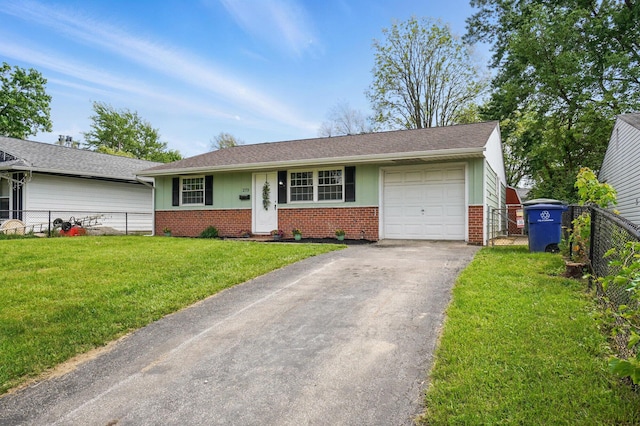 273 E Alcott Rd, Columbus, OH 43207 - ranch-style house with brick siding, driveway, a garage, and board and batten siding