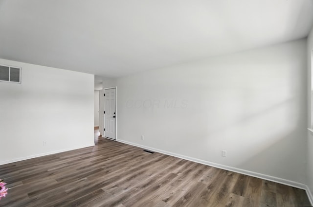 273 E Alcott Rd, Columbus, OH 43207 - spare room featuring dark wood-type flooring and baseboards