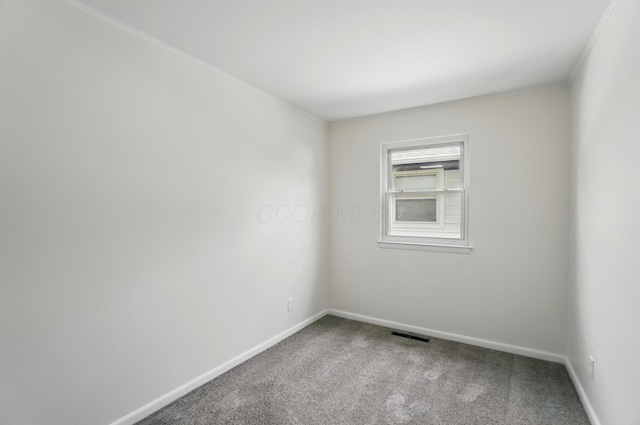 273 E Alcott Rd, Columbus, OH 43207 - carpeted empty room featuring baseboards and crown molding