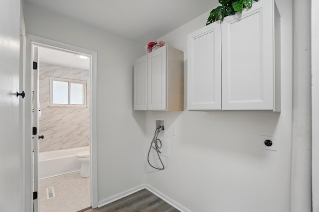 273 E Alcott Rd, Columbus, OH 43207 - laundry room featuring hookup for an electric dryer, washer hookup, cabinet space, baseboards, and dark wood-type flooring