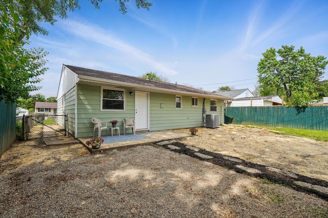 273 E Alcott Rd, Columbus, OH 43207 - rear view of property with fence, central AC, a gate, and a patio area