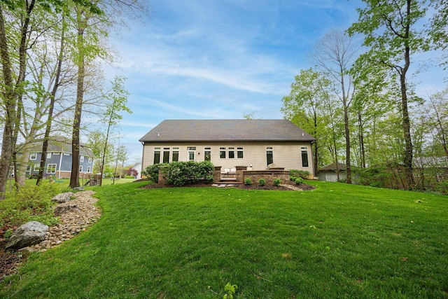 back of house with a yard and a deck