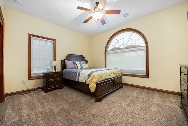 bedroom featuring carpet floors, baseboards, and a ceiling fan