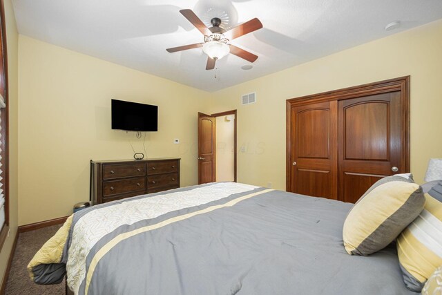 bedroom with carpet flooring, a ceiling fan, and baseboards