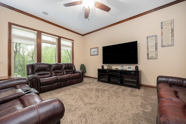 living area with baseboards, carpet flooring, ceiling fan, and ornamental molding