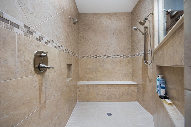 full bathroom with a tile shower