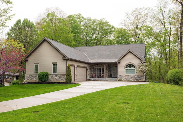 view of front of house featuring a garage, a front yard, stone siding, concrete driveway, and a shingled roof