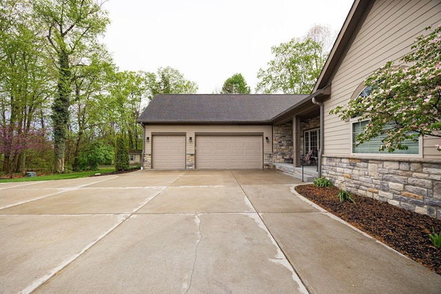 garage featuring driveway