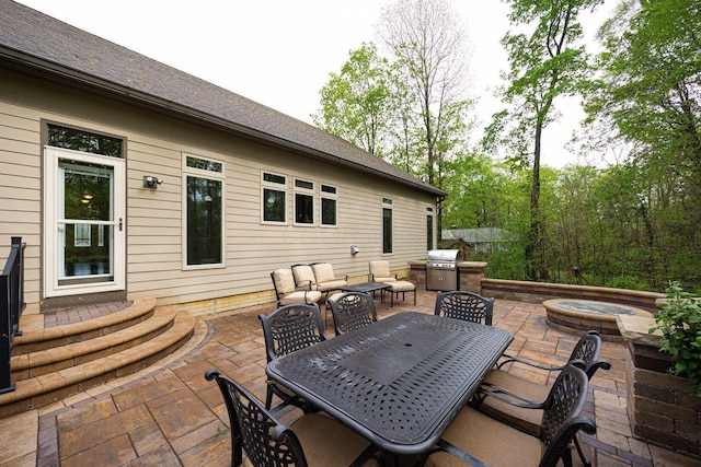 view of patio / terrace featuring outdoor dining area, area for grilling, and an outdoor hangout area