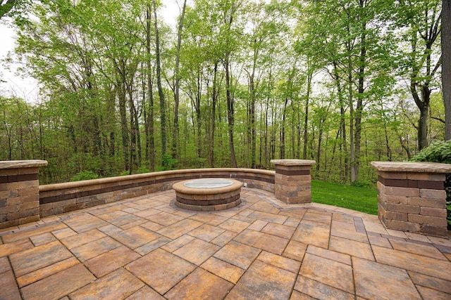 view of patio with a fire pit