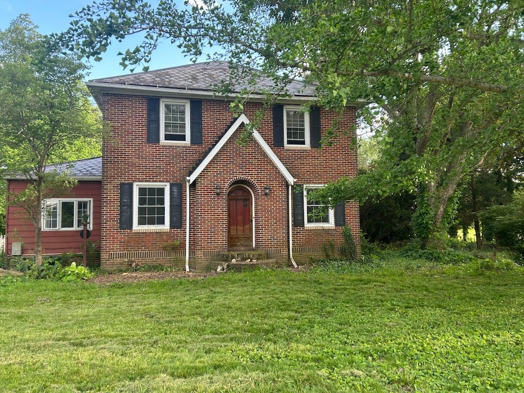 5 Baltimore Somerset Rd NE, Baltimore, OH 43105 - tudor home with brick siding, a front lawn, and a shingled roof