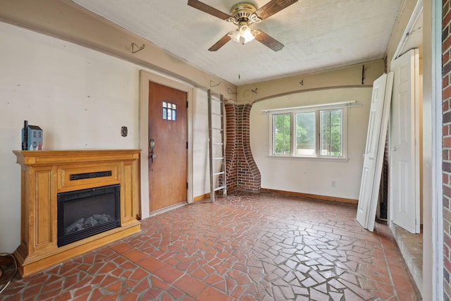 5 Baltimore Somerset Rd NE, Baltimore, OH 43105 - unfurnished living room with baseboards, ceiling fan, and a glass covered fireplace