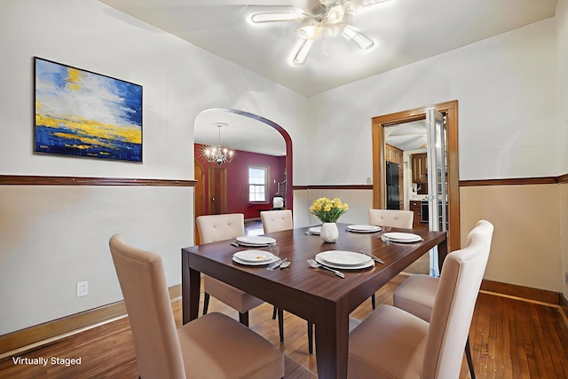 5 Baltimore Somerset Rd NE, Baltimore, OH 43105 - dining space featuring ceiling fan, baseboards, hardwood / wood-style floors, arched walkways, and vaulted ceiling