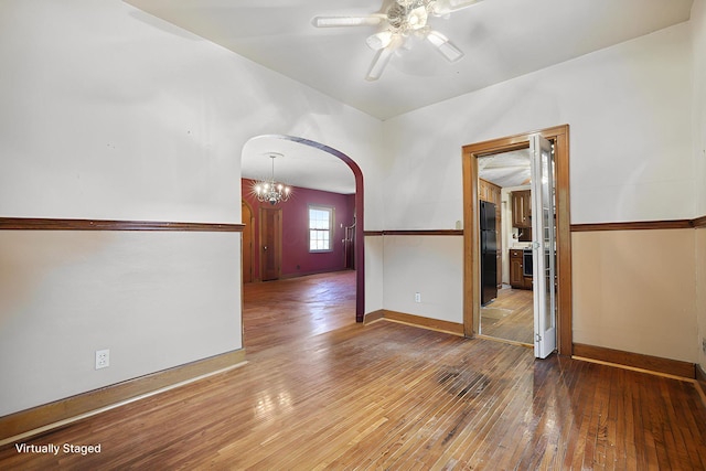 5 Baltimore Somerset Rd NE, Baltimore, OH 43105 - spare room featuring arched walkways, ceiling fan, hardwood / wood-style flooring, vaulted ceiling, and baseboards