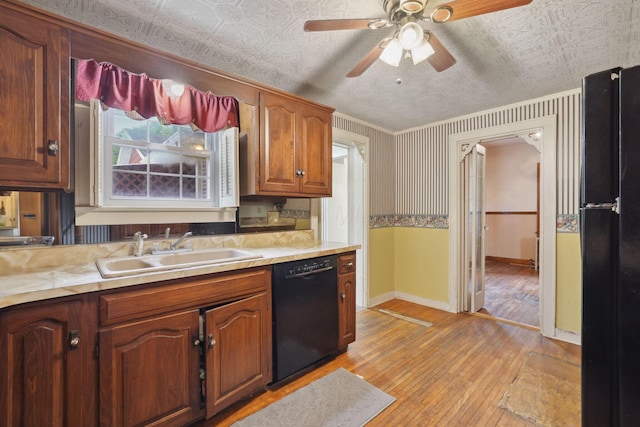 5 Baltimore Somerset Rd NE, Baltimore, OH 43105 - kitchen featuring black appliances, a sink, light wood-style flooring, baseboards, and an ornate ceiling