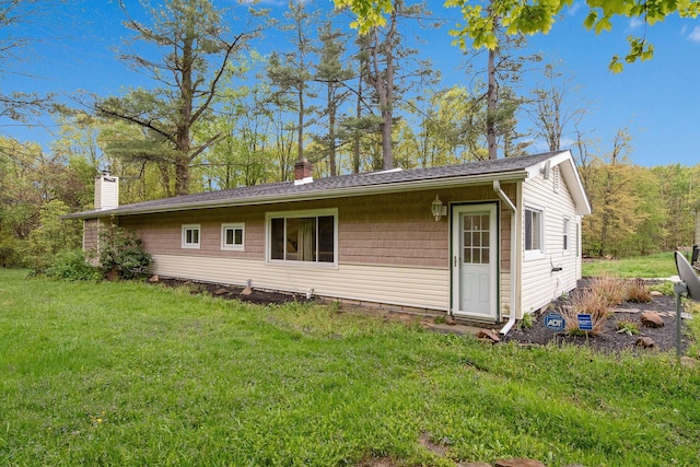 6810 Barrett Rd, Geneva, OH 44041 - back of property with a chimney and a lawn