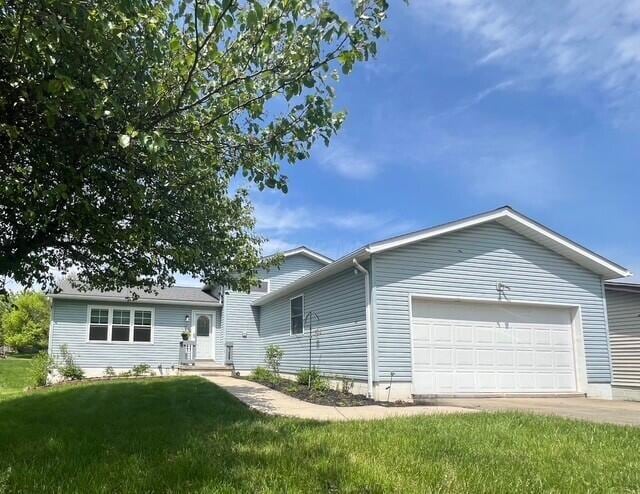 134 Hasbrouck Cir, Howard, OH 43028 - view of front facade with a garage, a front lawn, and driveway