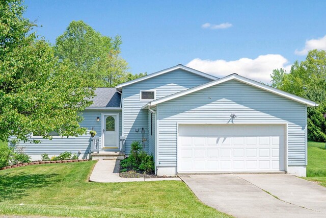 134 Hasbrouck Cir, Howard, OH 43028 - view of front facade featuring an attached garage, concrete driveway, a front lawn, and a shingled roof