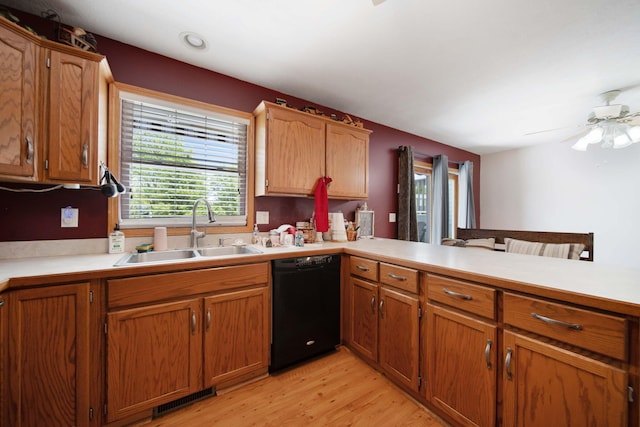 134 Hasbrouck Cir, Howard, OH 43028 - kitchen featuring black dishwasher, a sink, light wood-style floors, and light countertops