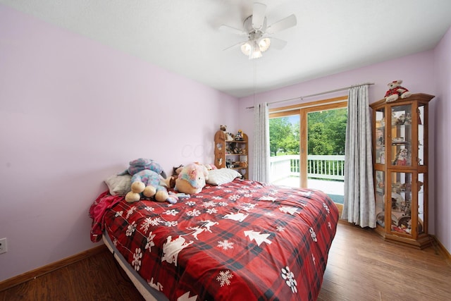 134 Hasbrouck Cir, Howard, OH 43028 - bedroom featuring access to exterior, baseboards, wood finished floors, and a ceiling fan